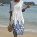 Flowing floral maxi dress with a round neckline and easy relaxed silhouette