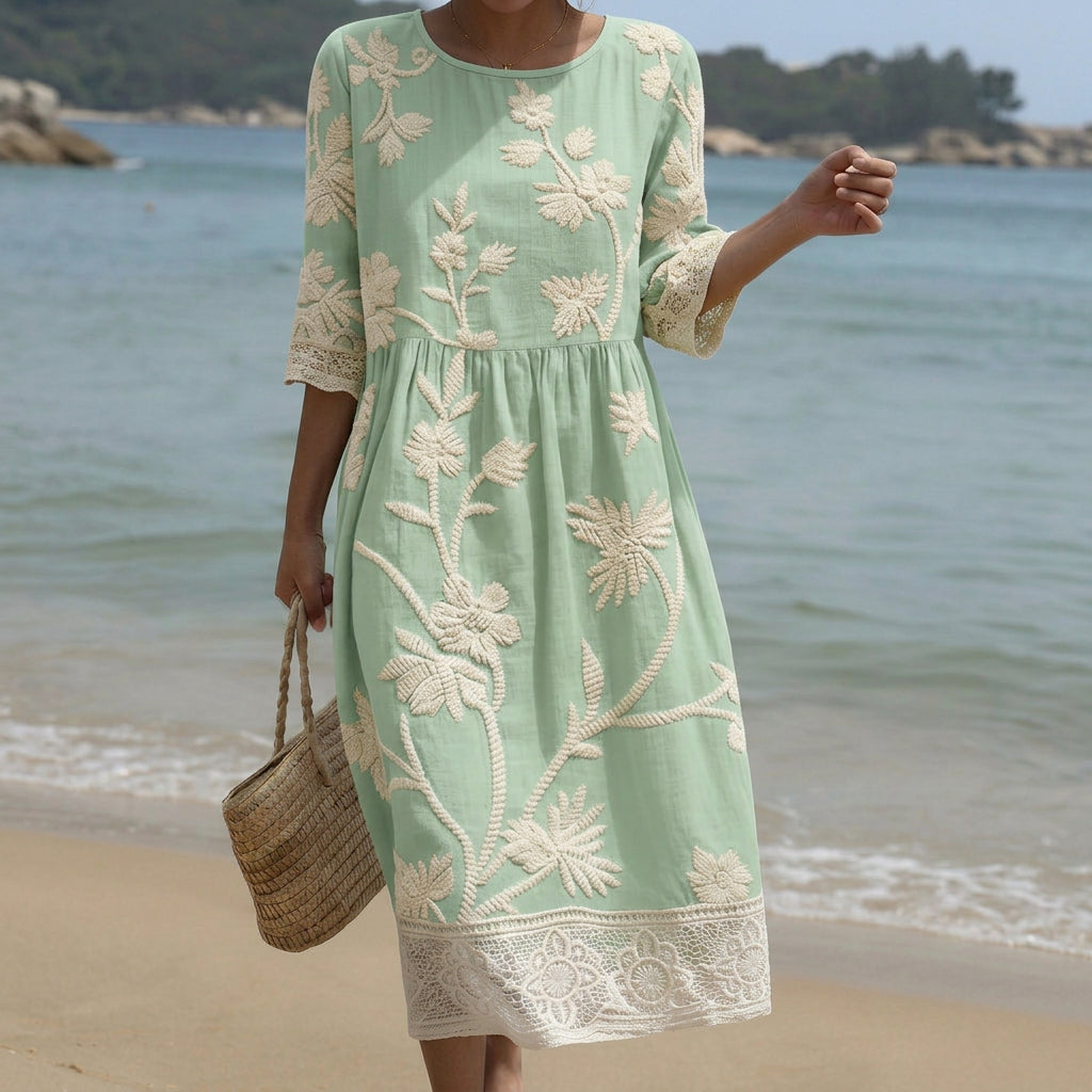 Flowing botanical print midi dress with a soft relaxed silhouette in warm floral tones