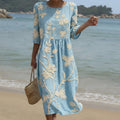 Flowing botanical print midi dress with a soft relaxed silhouette in spring florals