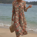 Elegant floral maxi dress with soft round neck in a flowing relaxed cut
