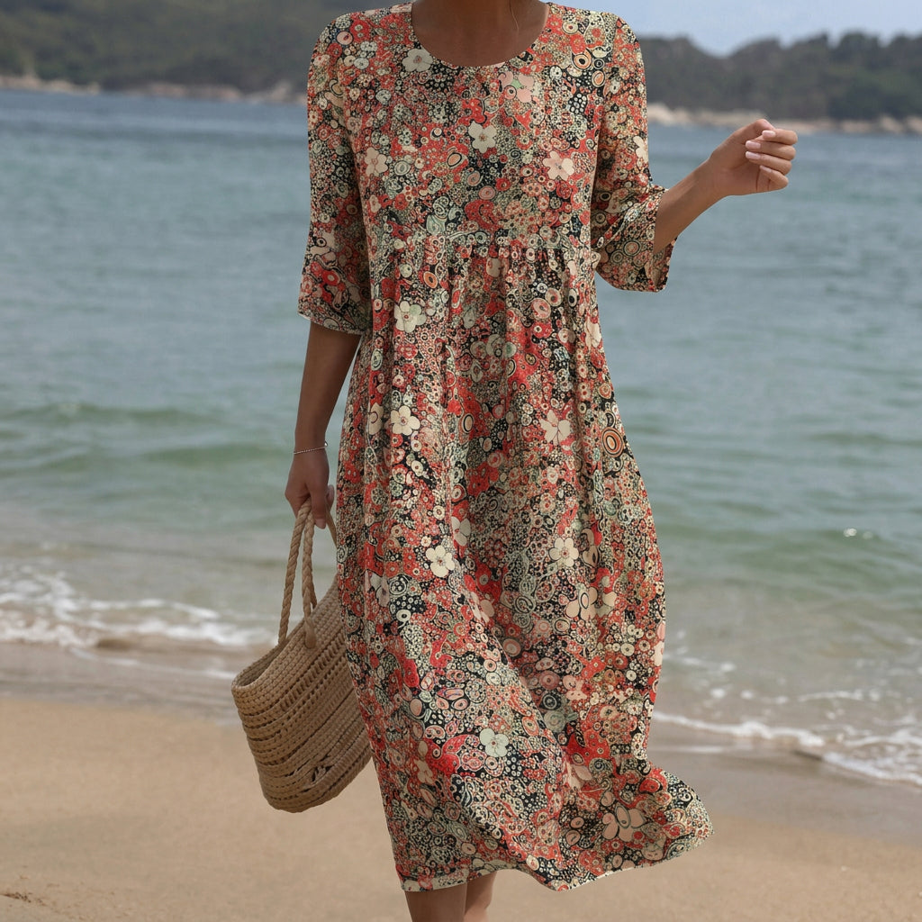 Elegant floral maxi dress with soft round neck in a flowing relaxed cut