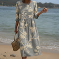 Flowing botanical print midi dress with a relaxed flattering silhouette