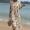 Fluid floral maxi dress with a classic botanical print in soft summer tones