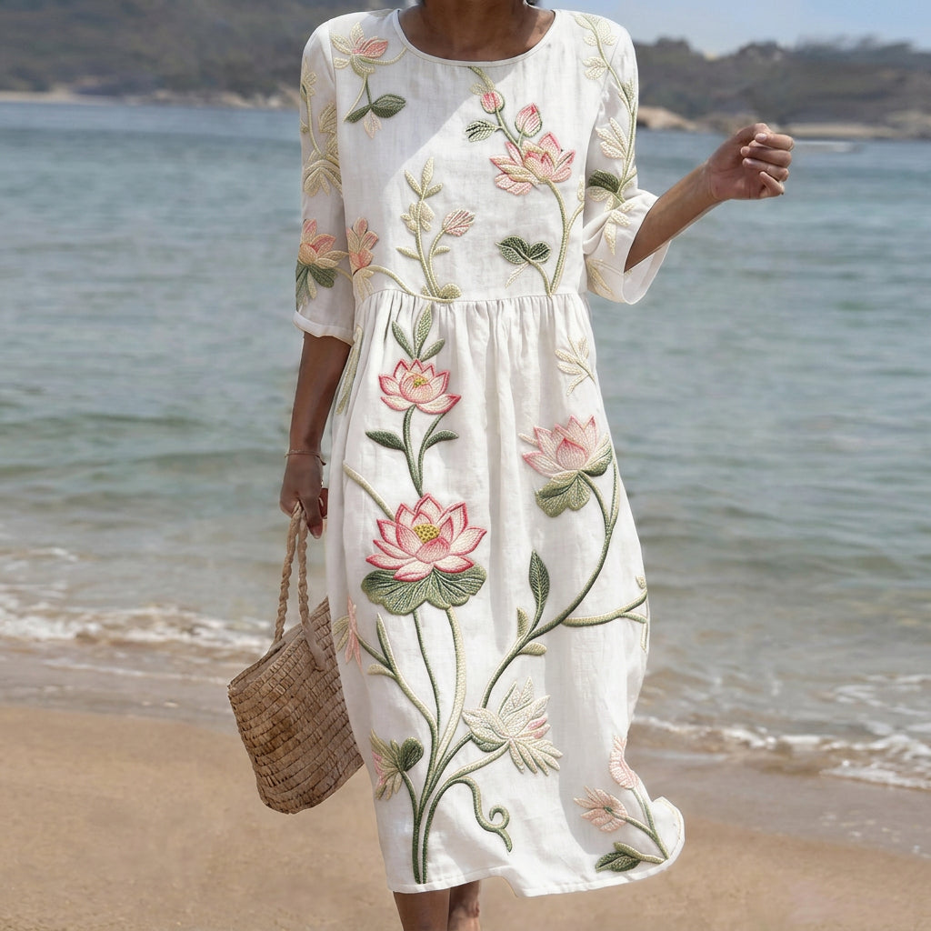 Flowing botanical print dress with a relaxed elegant silhouette in soft floral tones