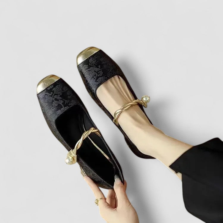 A woman in sparkling Mary Jane shoes with a low block heel at an evening celebration.