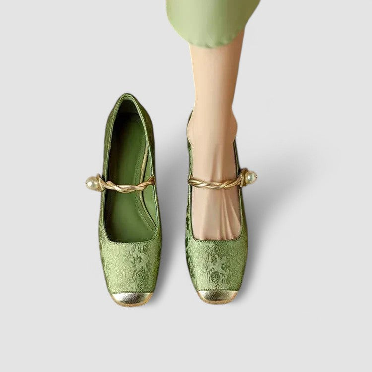 A woman in sparkling Mary Jane shoes with a low block heel at an evening celebration.