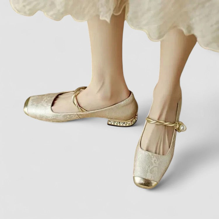 A woman in sparkling Mary Jane shoes with a low block heel at an evening celebration.