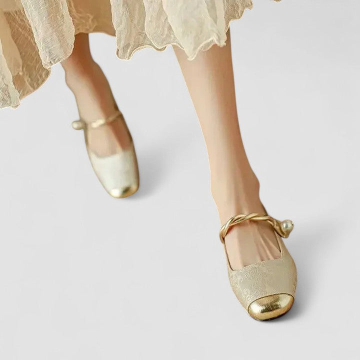 A woman wearing embellished green Mary Jane flats at a special occasion.
