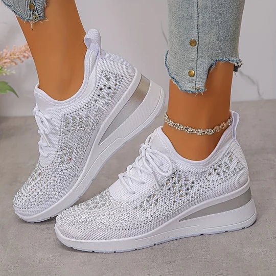 A woman walking comfortably outdoors in supportive everyday shoes.