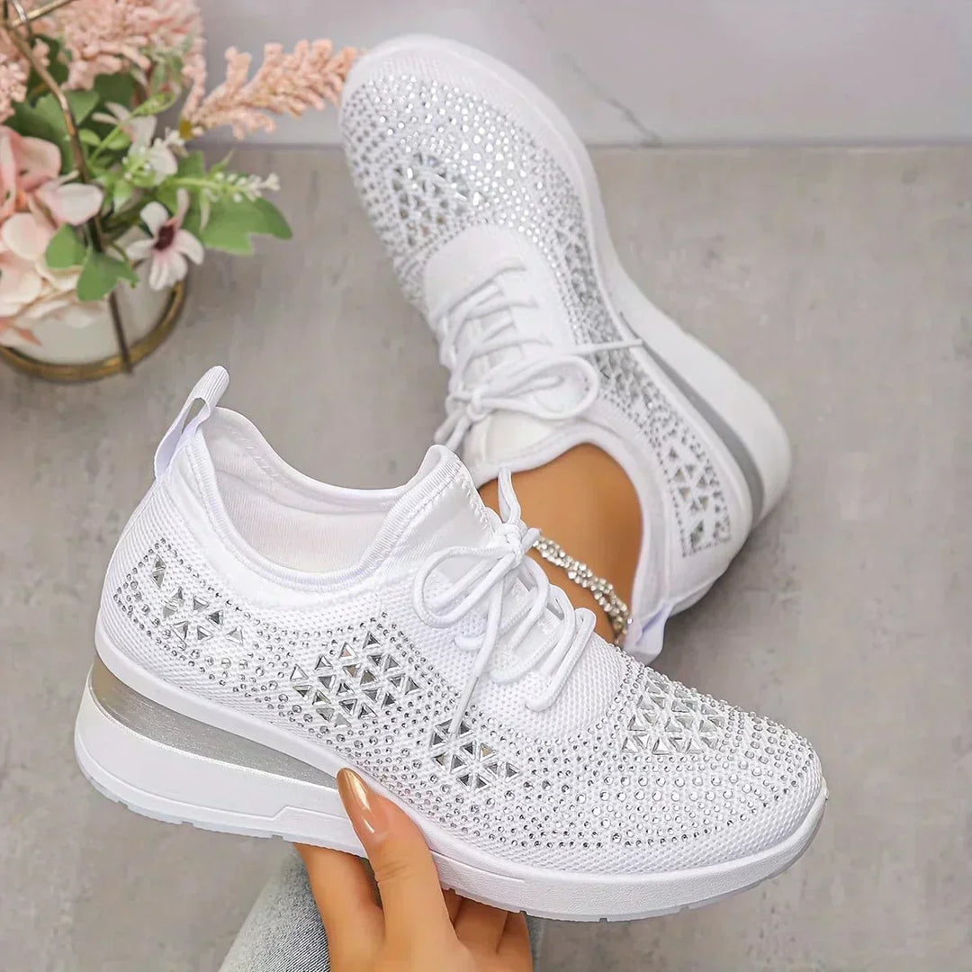 A woman walking comfortably outdoors in supportive everyday shoes.