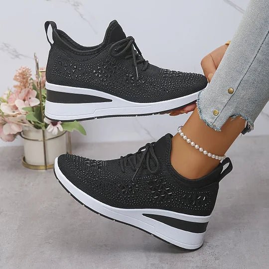A woman walking comfortably outdoors in supportive everyday shoes.