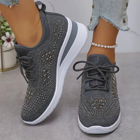 A woman walking comfortably outdoors in supportive everyday shoes.