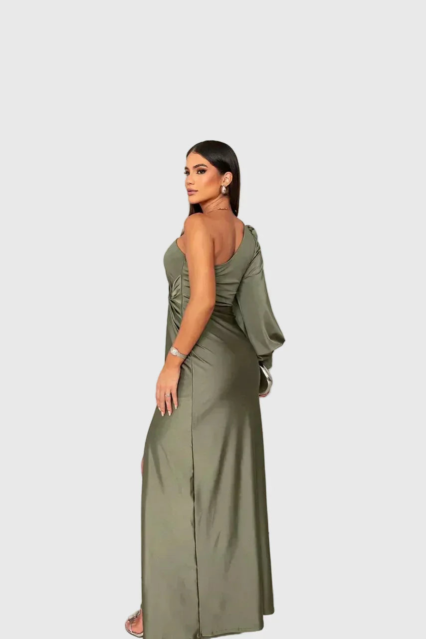 Woman wearing a long flowing evening maxi dress with elegant, graceful lines.