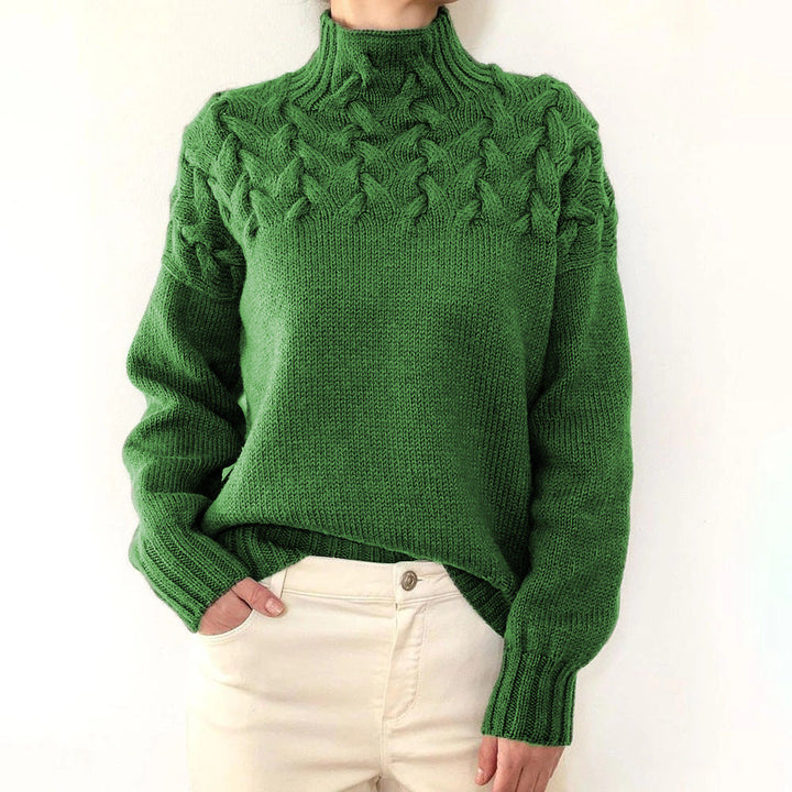 A woman wearing a warm roll-neck jumper, cosy and elegant on a cold winter day.