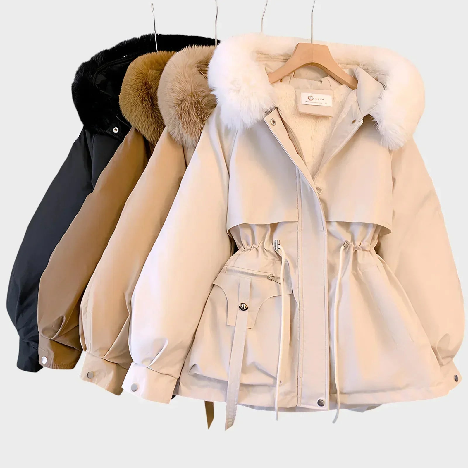 An elegant structured winter coat in camel, styled over a layered winter outfit