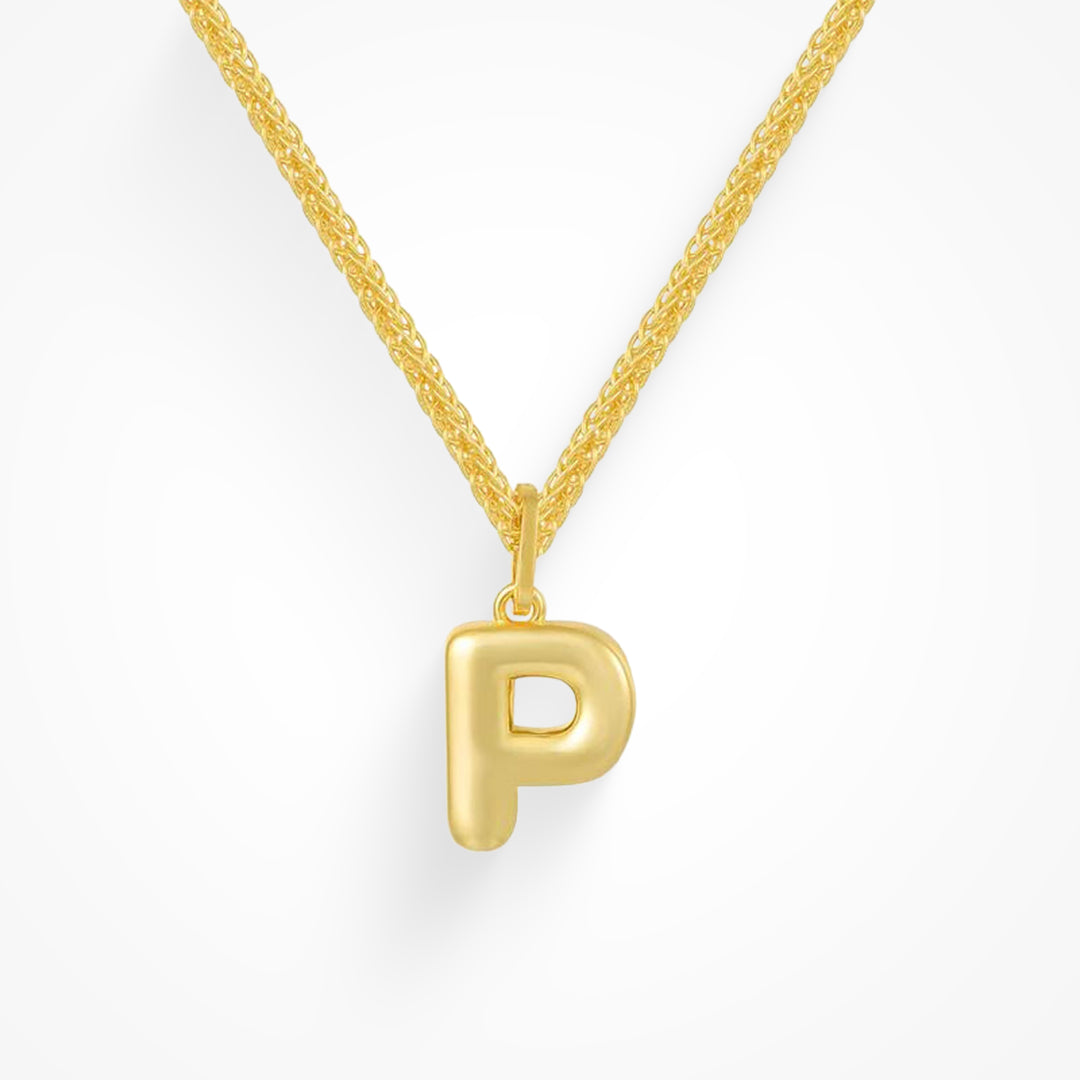 Layering necklace in gold and silver tones displayed on a clean background