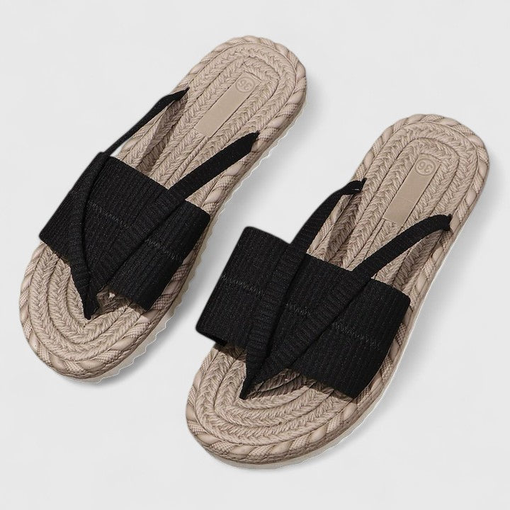 A woman moving freely in wide-fit open-front support sandals with a cushioned footbed.