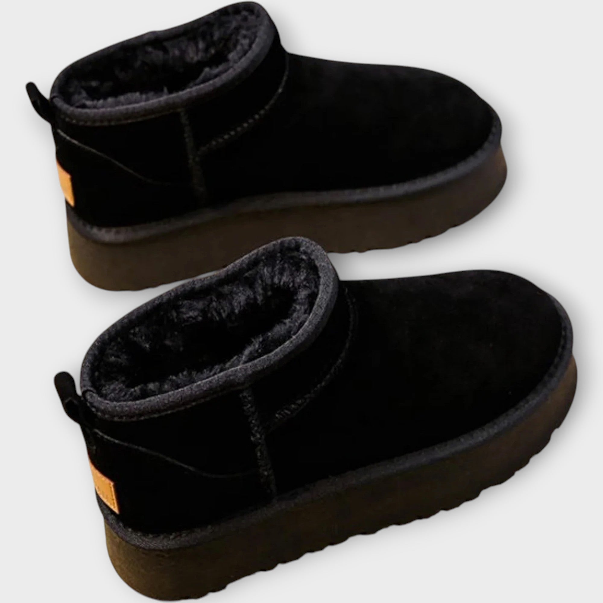 Cosy lined ankle boots in tan and black with a smooth upper and durable sole
