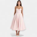 Romantic layered midi dress with full skirt and hidden pockets in soft blush pink