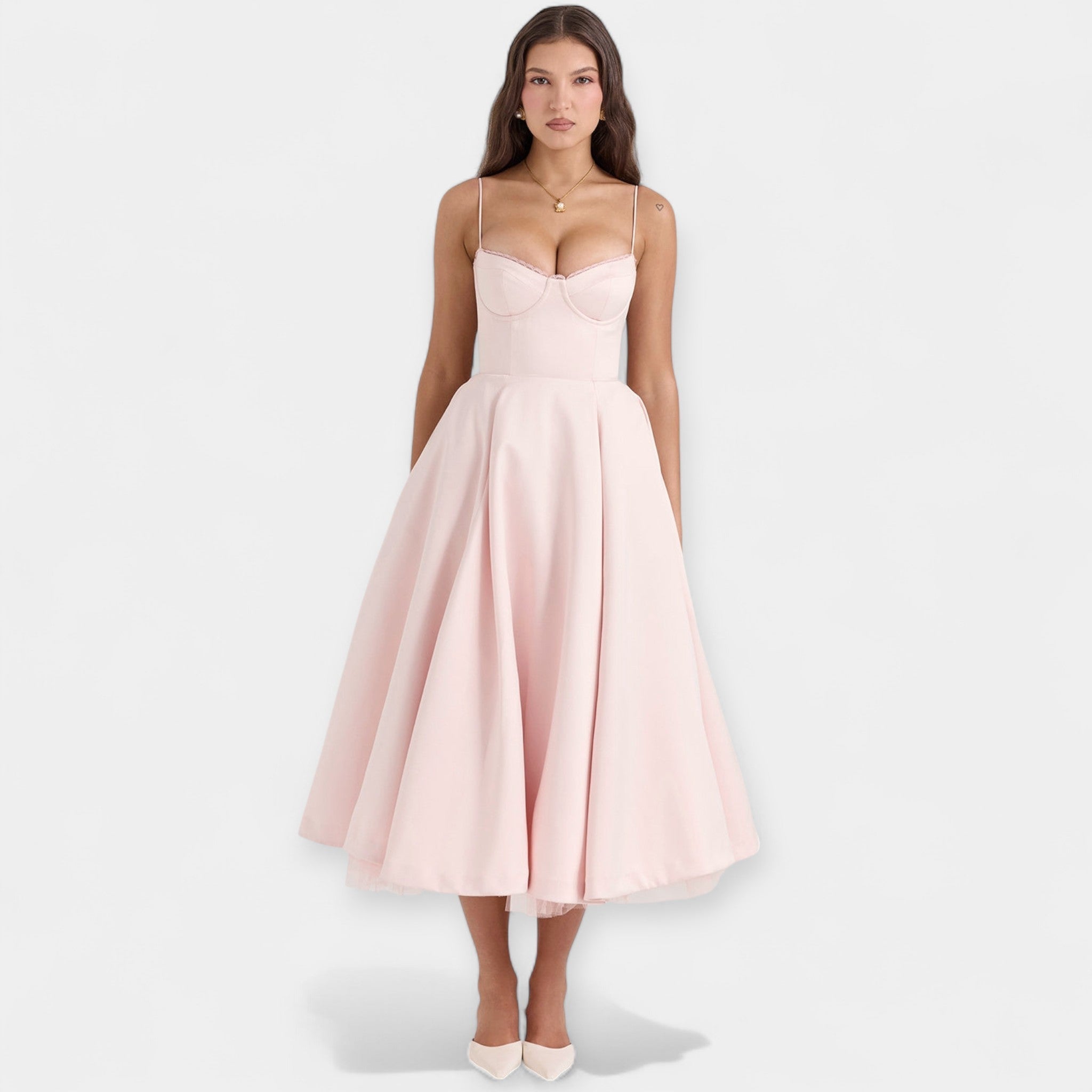 Romantic layered midi dress with full skirt and hidden pockets in soft blush pink