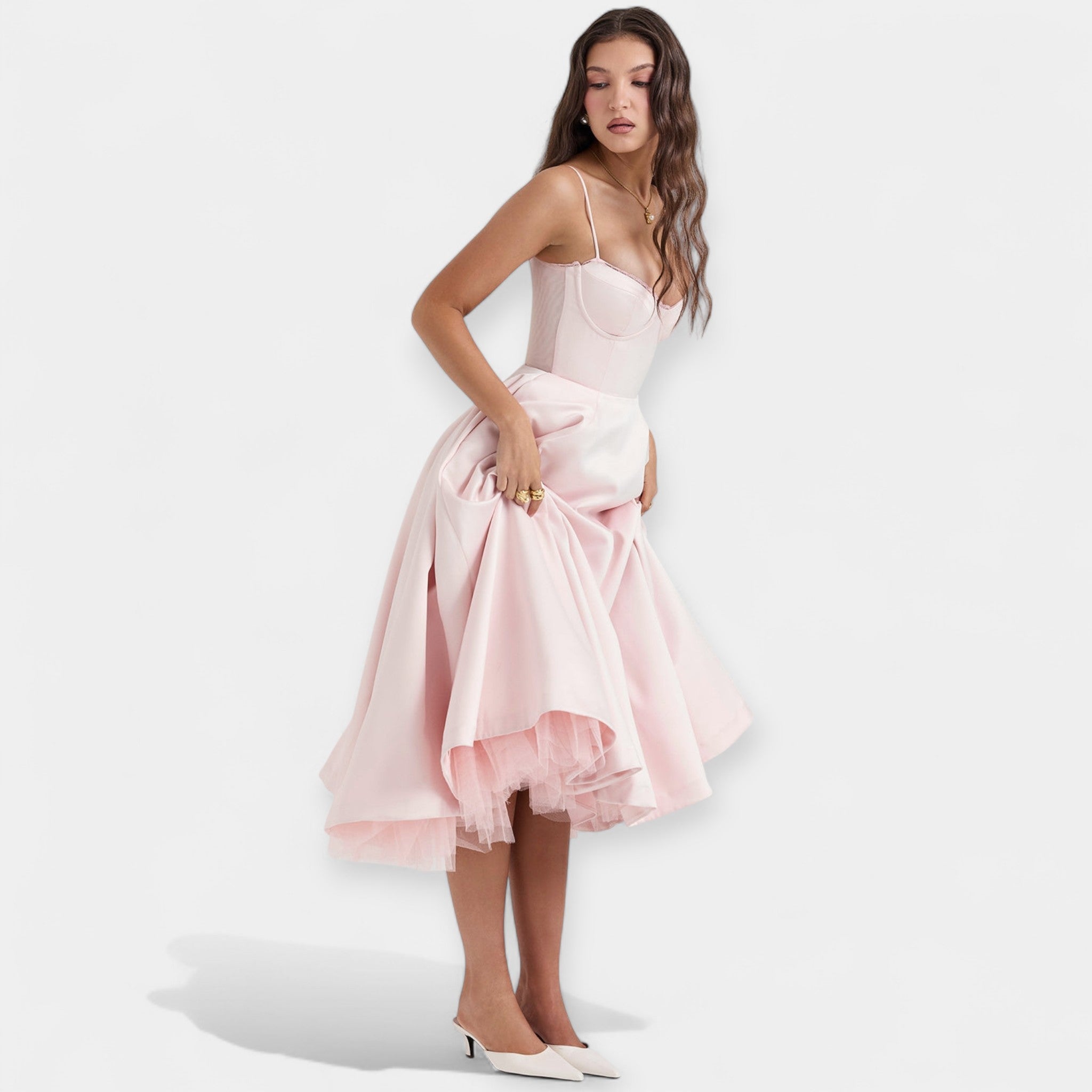 Romantic layered midi dress with full skirt and hidden pockets in soft blush pink