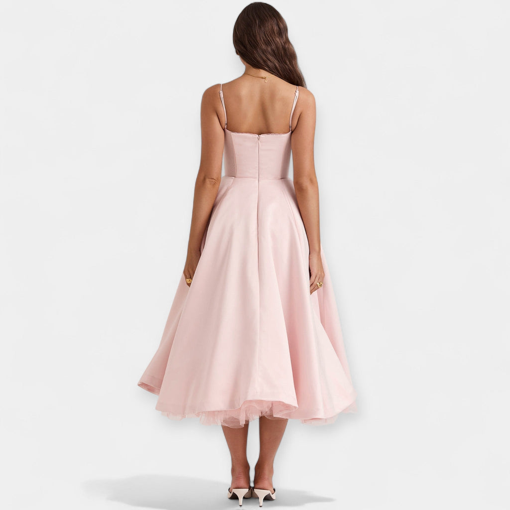 Romantic layered midi dress with full skirt and hidden pockets in soft blush pink