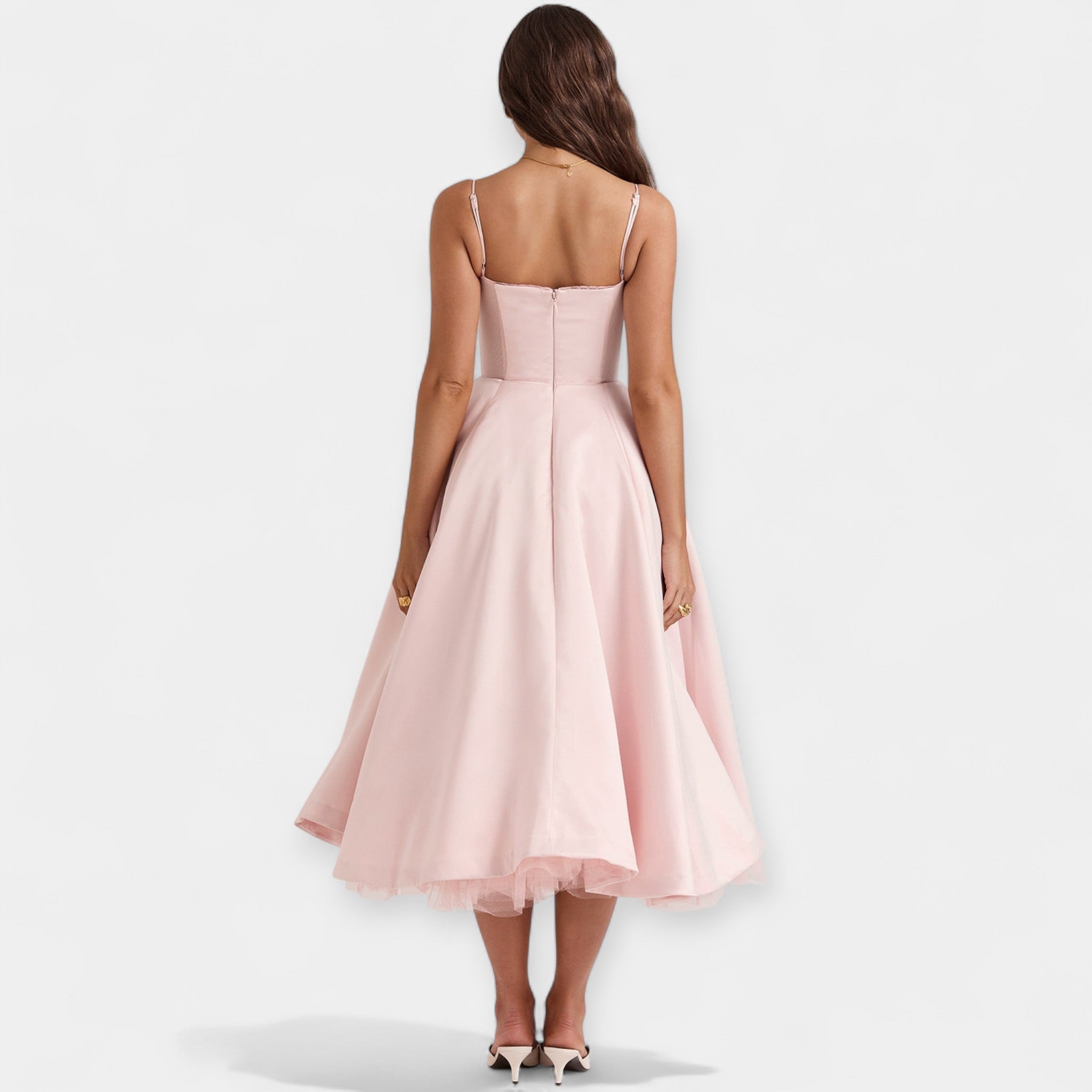 Romantic layered midi dress with full skirt and hidden pockets in soft blush pink