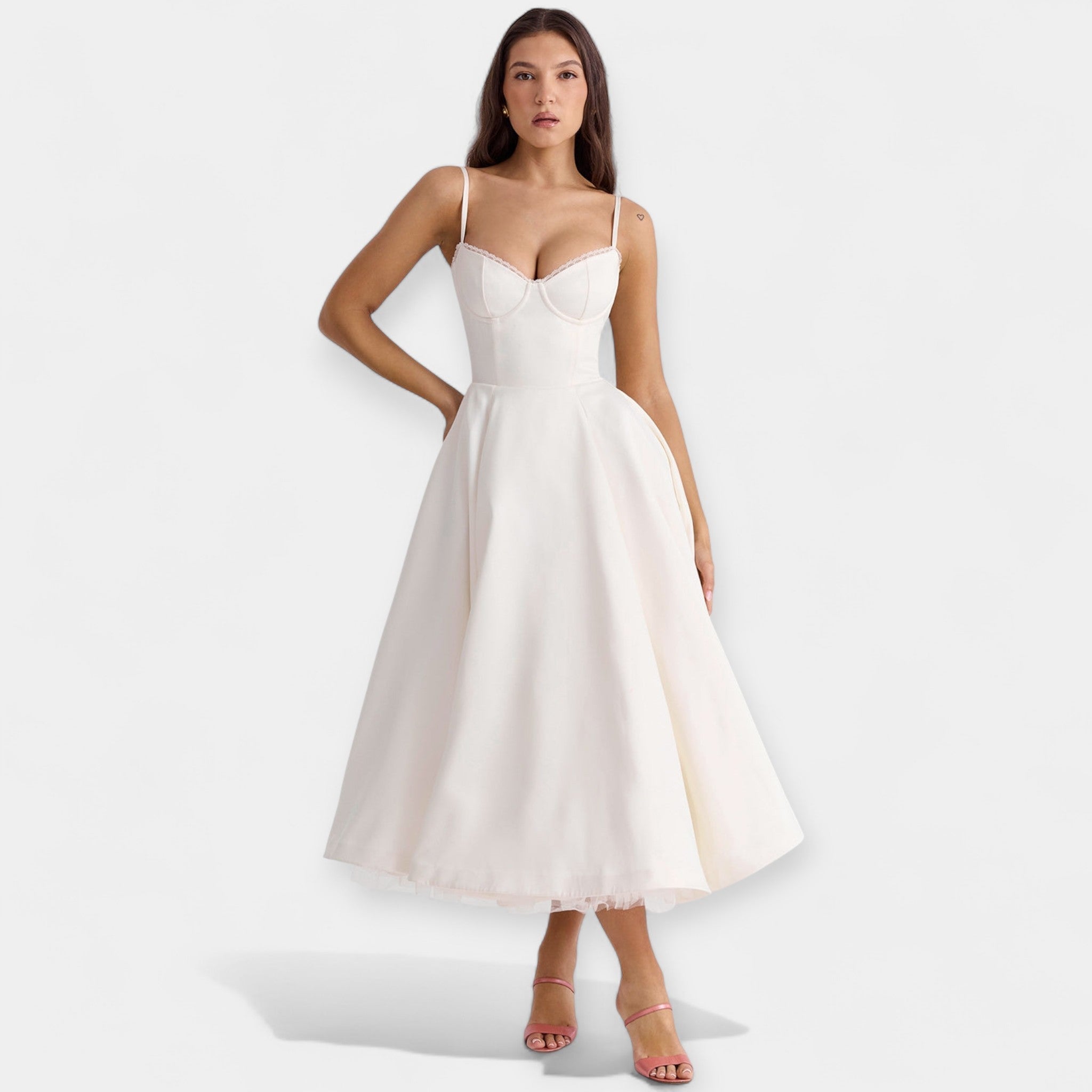 Romantic layered midi dress with full skirt and hidden pockets in soft blush pink