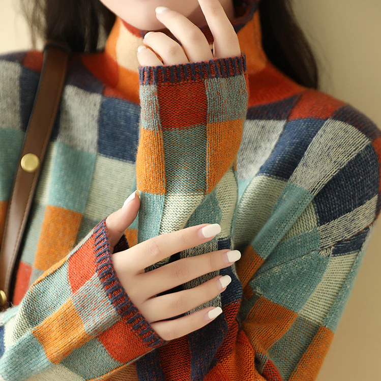 A woman wearing a colourful retro check jumper, relaxed and cosy on a cool autumn morning.