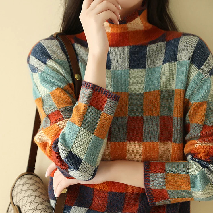 A woman wearing a colourful retro check jumper, relaxed and cosy on a cool autumn morning.