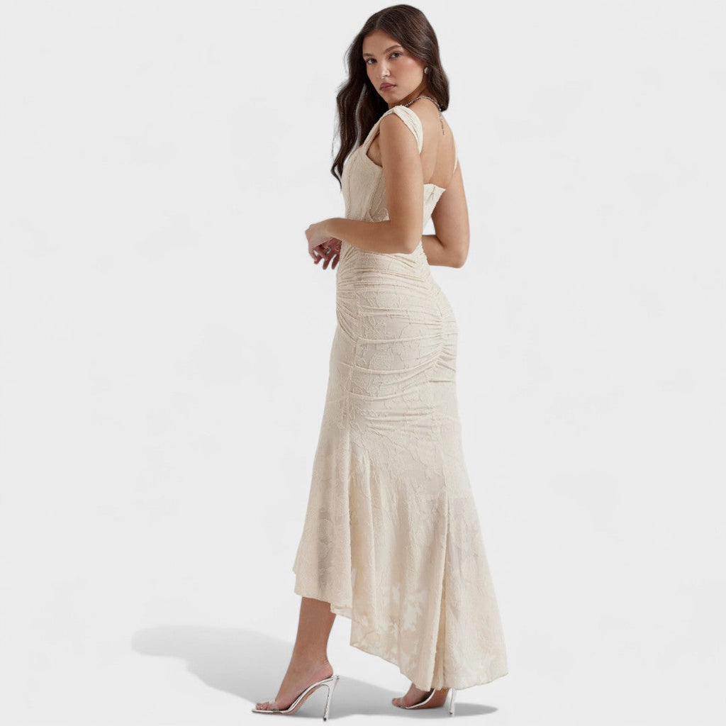 A romantic cream midi dress with square neckline and asymmetric hem, styled for a garden party