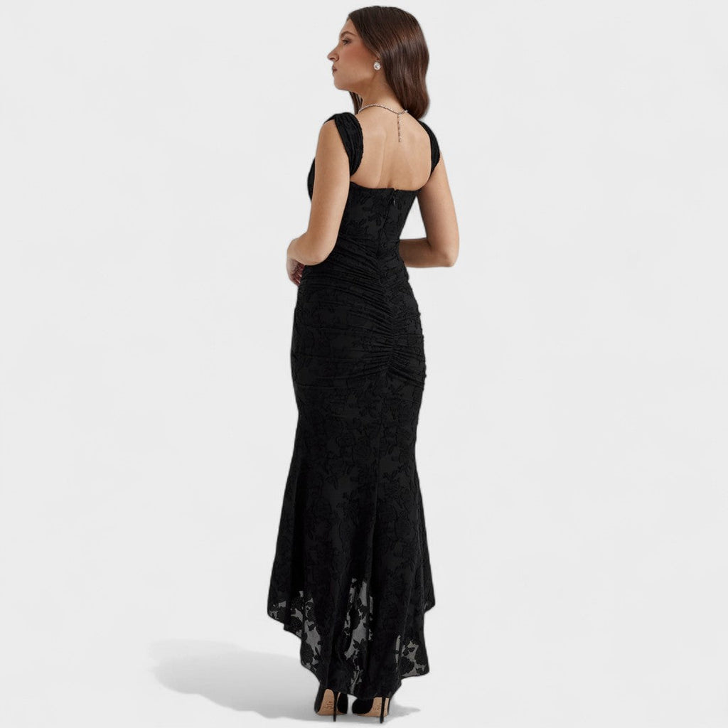 A romantic cream midi dress with square neckline and asymmetric hem, styled for a garden party