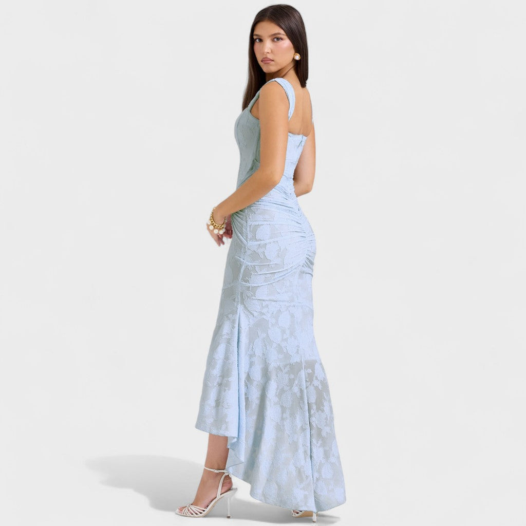 A romantic cream midi dress with square neckline and asymmetric hem, styled for a garden party