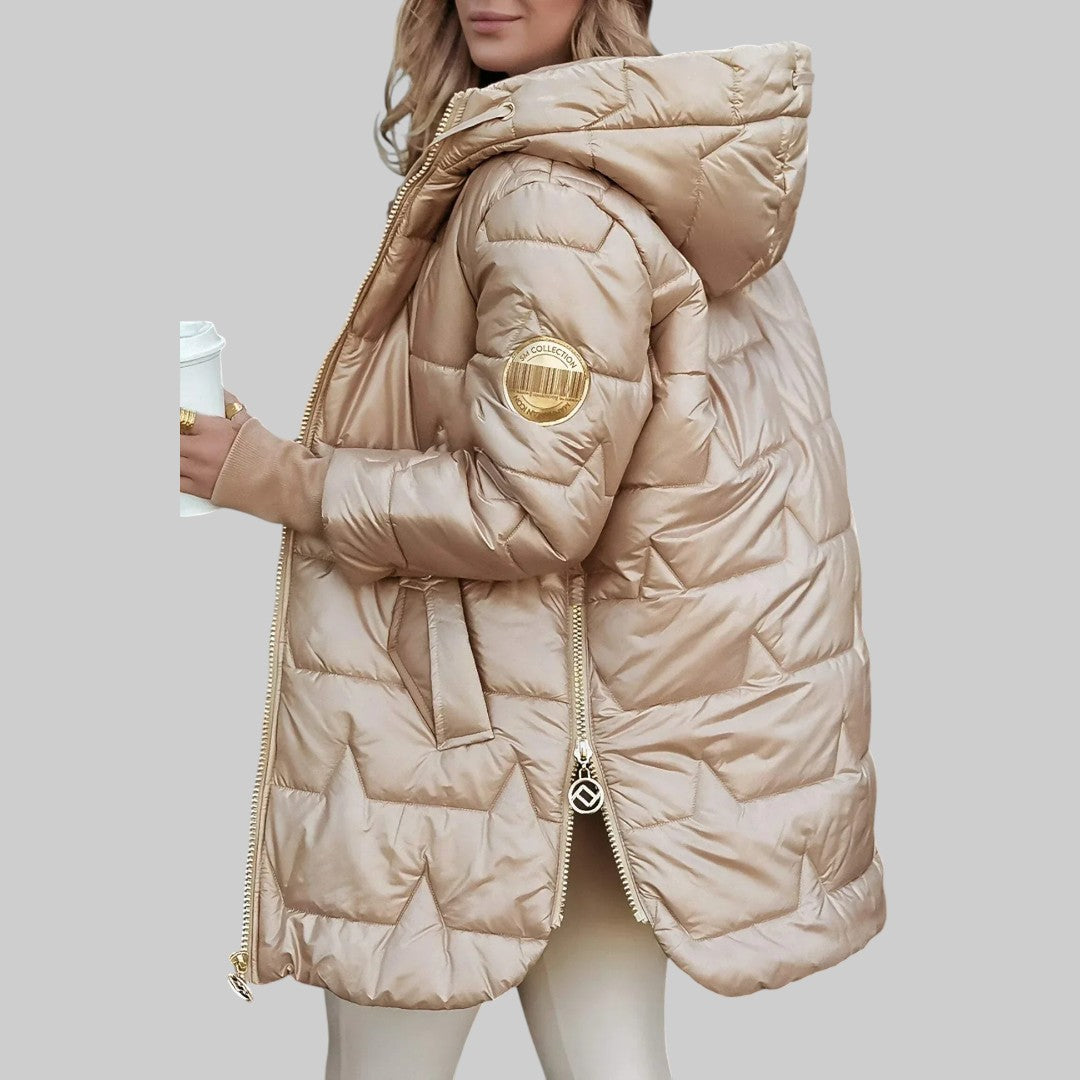 A woman wearing a hooded autumn coat in a timeless tone, sheltered from the wind.