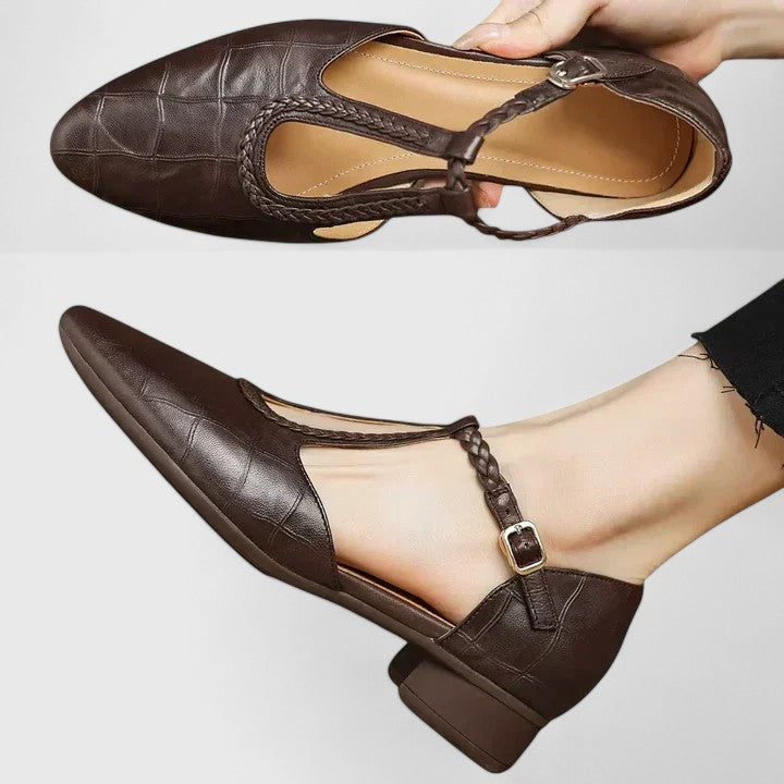 A woman walking gracefully in open-toe wide-fit comfort sandals with supportive straps.