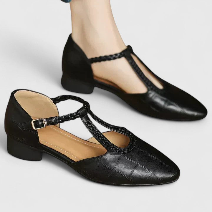 A woman walking gracefully in open-toe wide-fit comfort sandals with supportive straps.