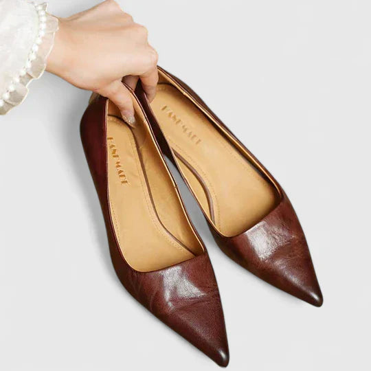 A woman in balanced comfort heels moving from the office to an evening reception.