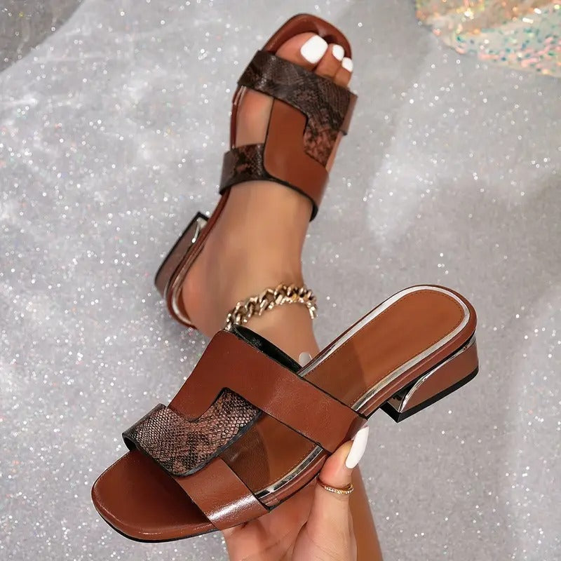 Brown low heel backless sandals with H-strap detail over the instep