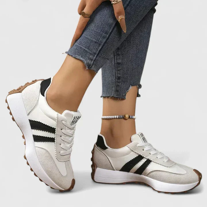 A woman wearing classic cushioned orthopaedic trainers