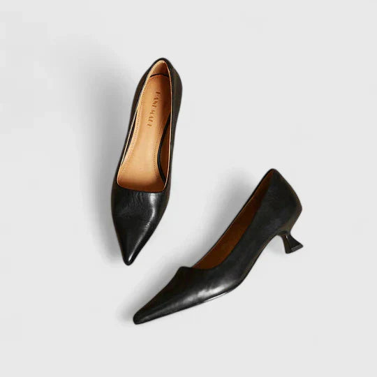 A woman in balanced comfort heels moving from the office to an evening reception.