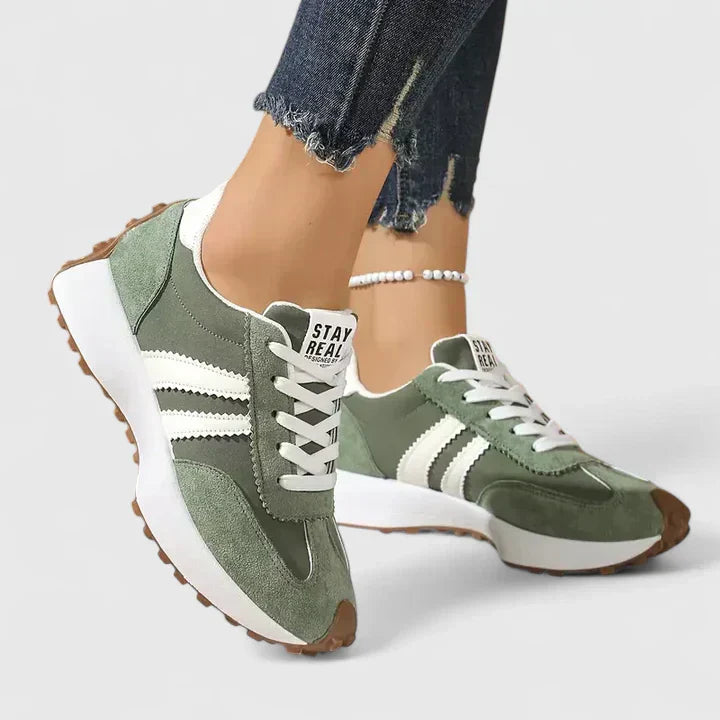 A woman wearing classic cushioned orthopaedic trainers