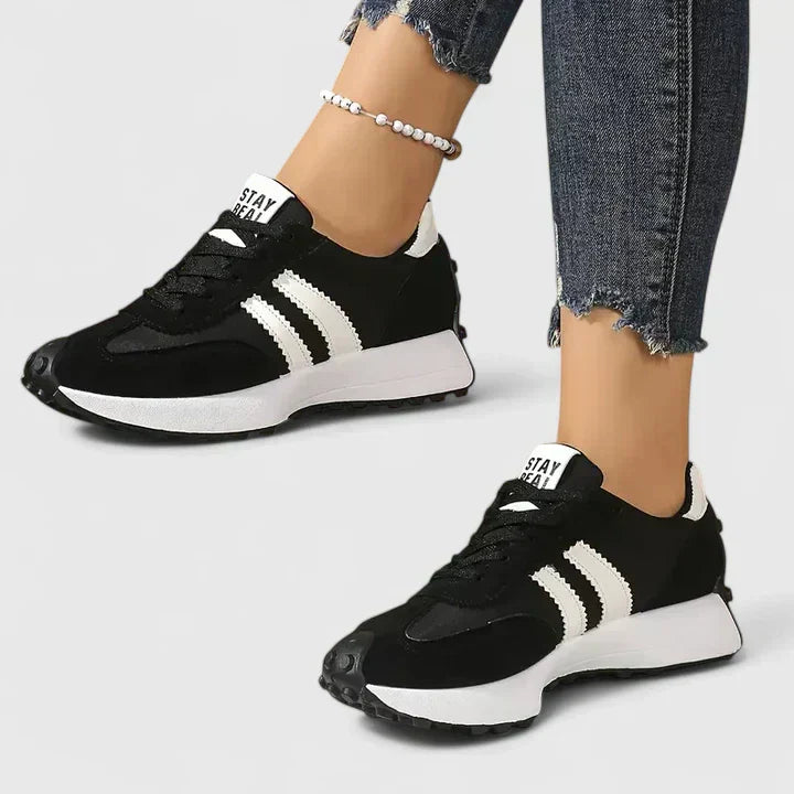 A woman wearing classic cushioned orthopaedic trainers
