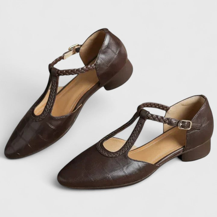 A woman walking gracefully in open-toe wide-fit comfort sandals with supportive straps.