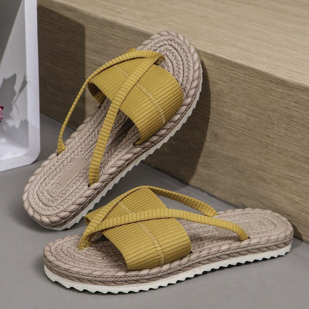 Flat crossover strap sandals in mint green with a simple, open toe-post design