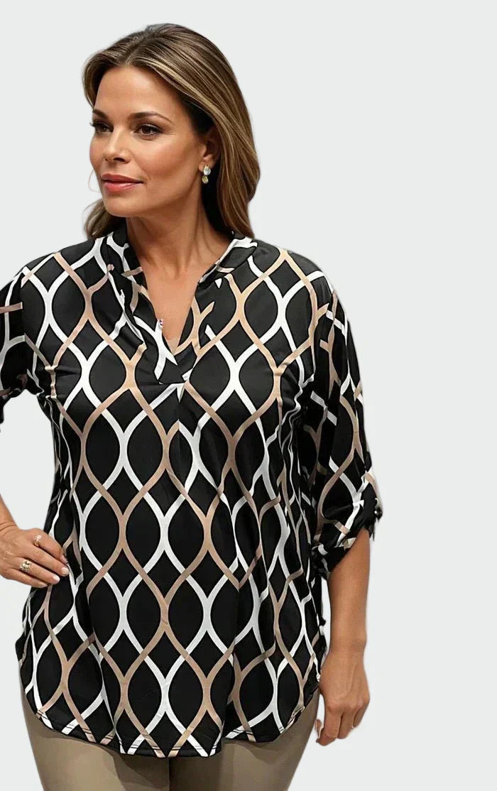 Women's long-sleeve blouse with bold geometric print in warm brown and white tones