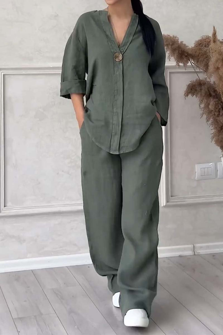 A woman wearing a loose relaxed top with matching wide-cut trousers.