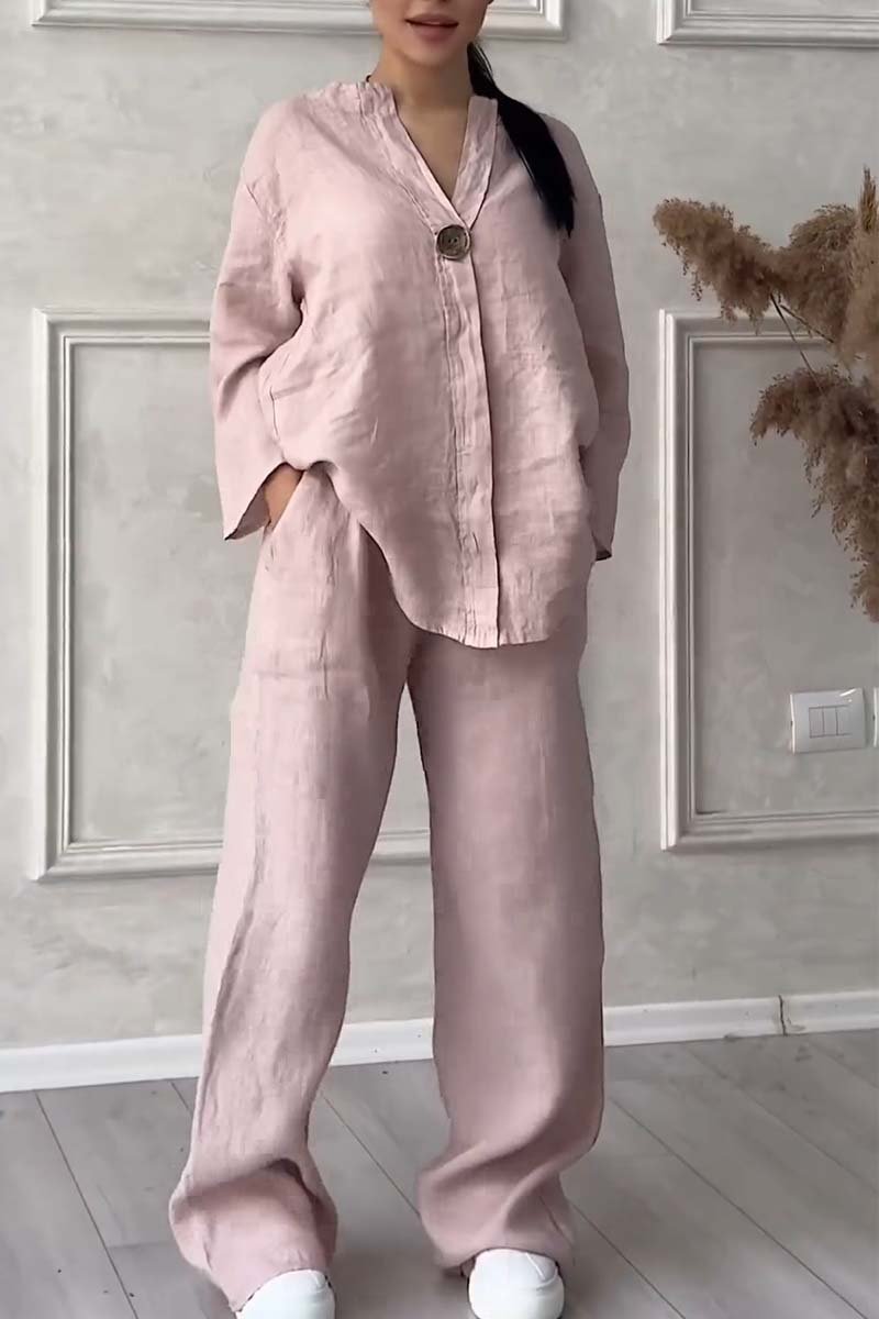 A woman wearing a loose relaxed top with matching wide-cut trousers.