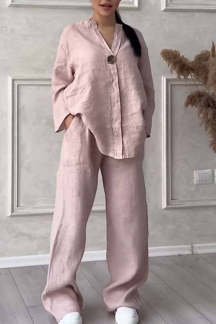 A woman wearing a loose relaxed top with matching wide-cut trousers.