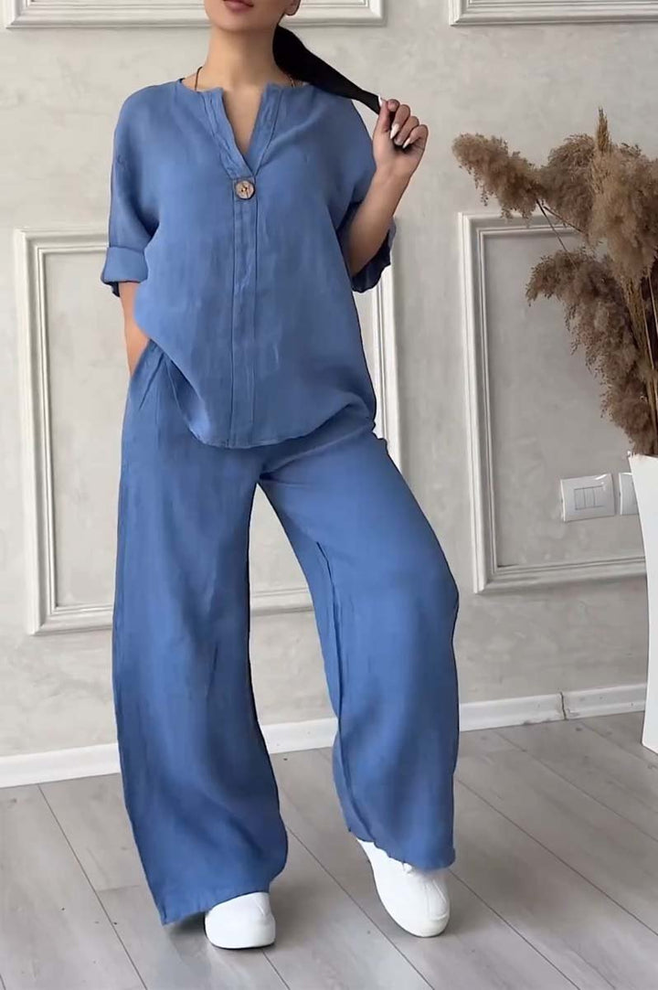 A woman wearing a loose relaxed top with matching wide-cut trousers.