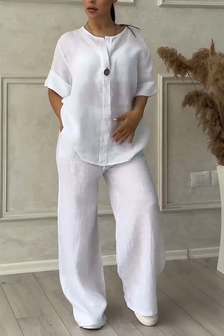 A woman wearing a loose relaxed top with matching wide-cut trousers.